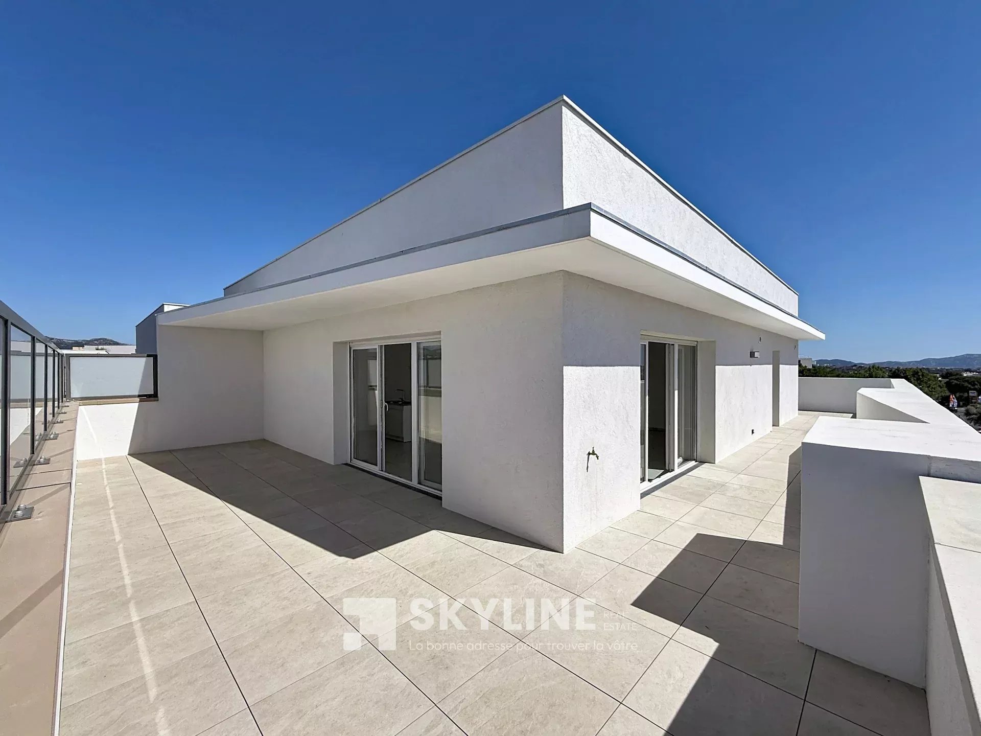 Photo 2 — SKYLINE REAL ESTATE