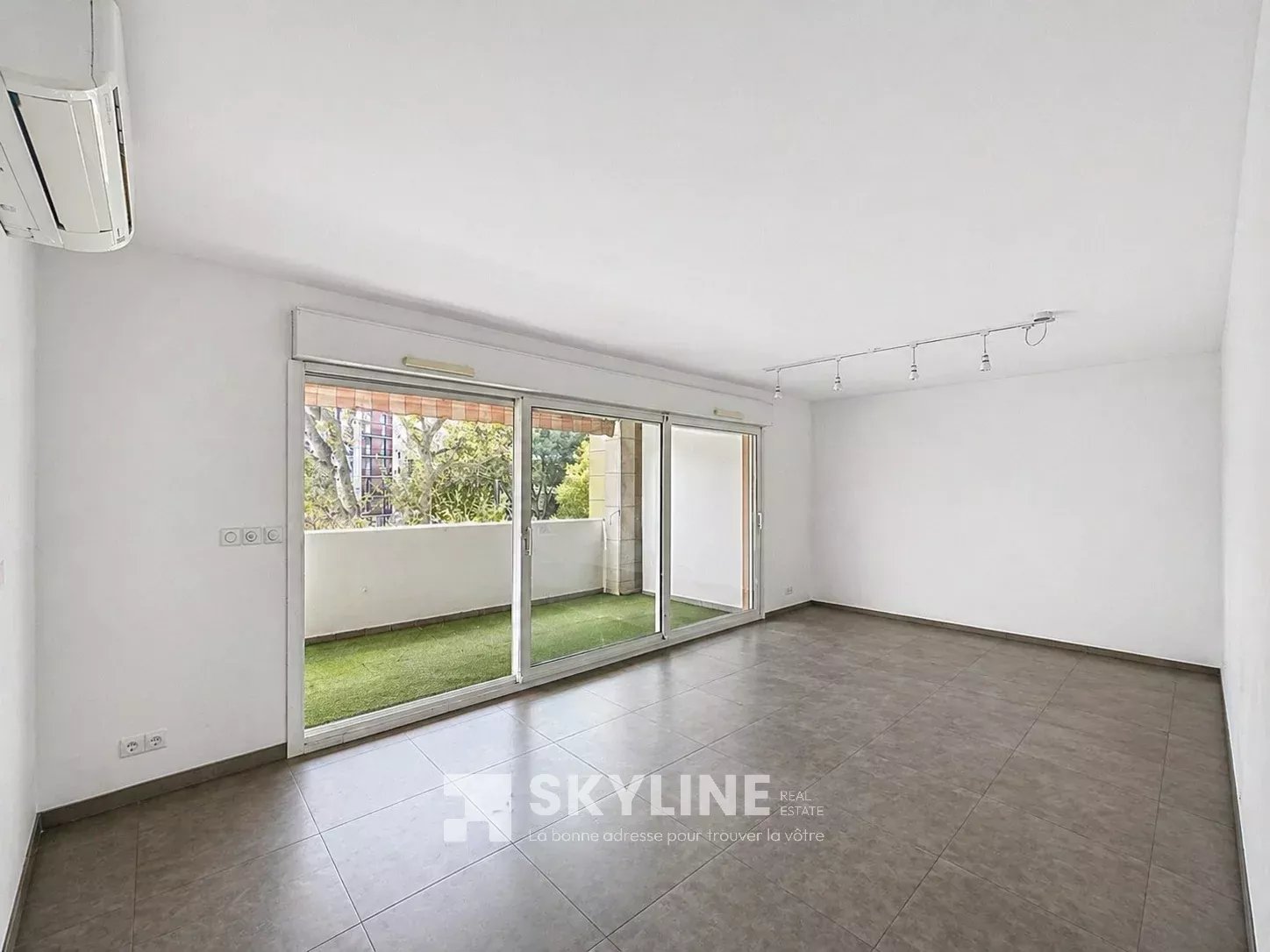 Photo 2 — SKYLINE REAL ESTATE