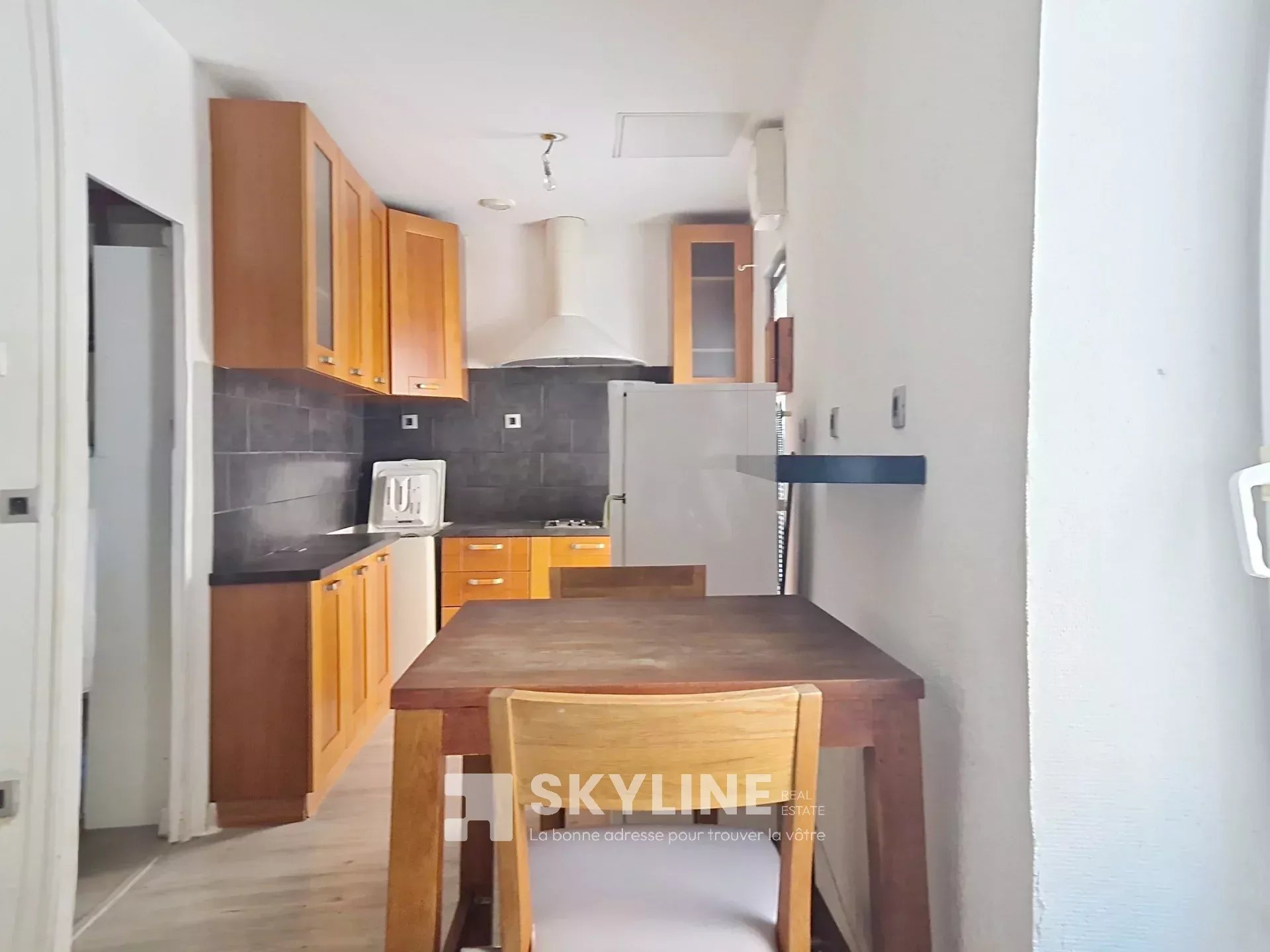 Photo 2 — SKYLINE REAL ESTATE