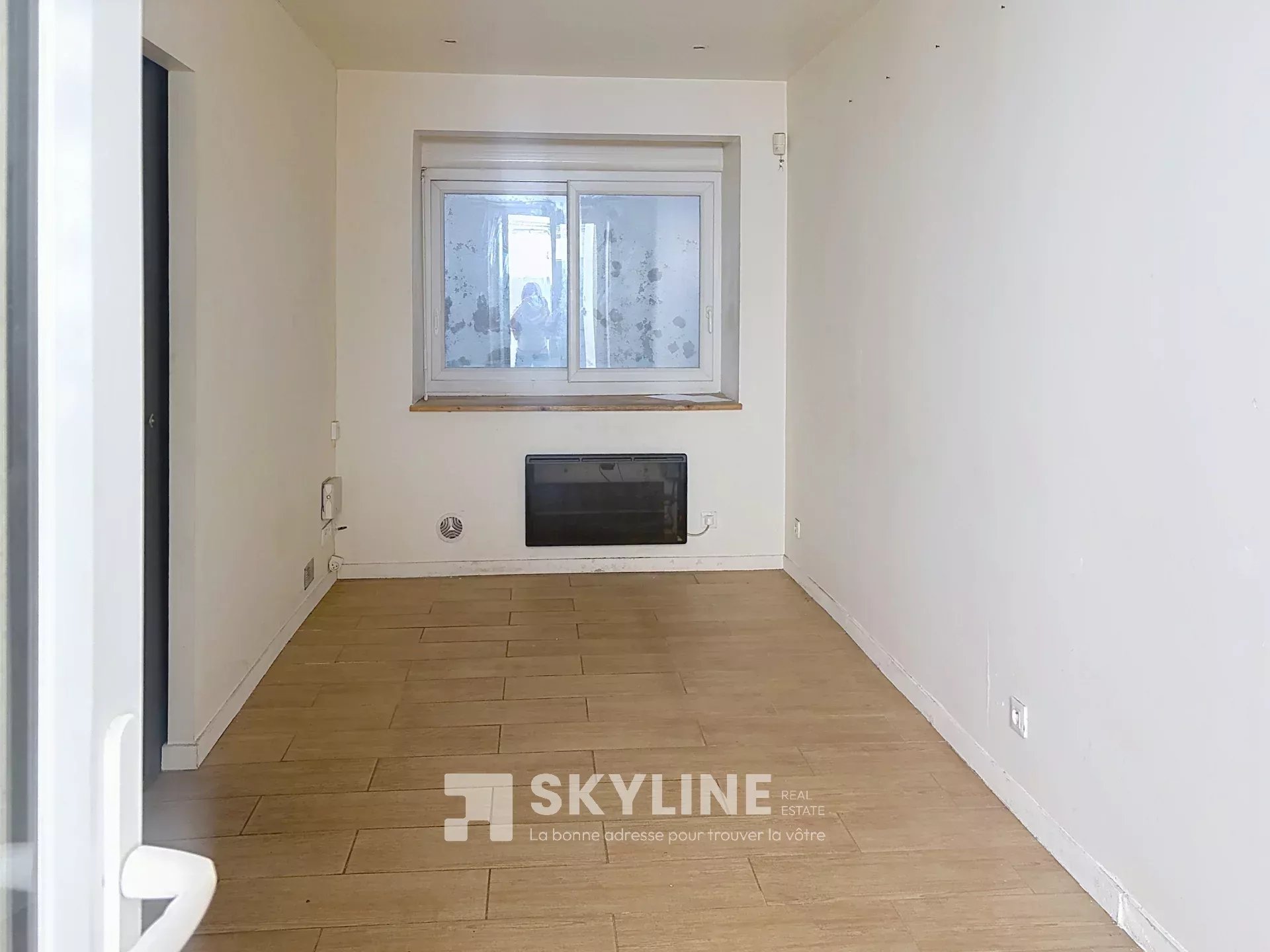 Photo 2 — SKYLINE REAL ESTATE